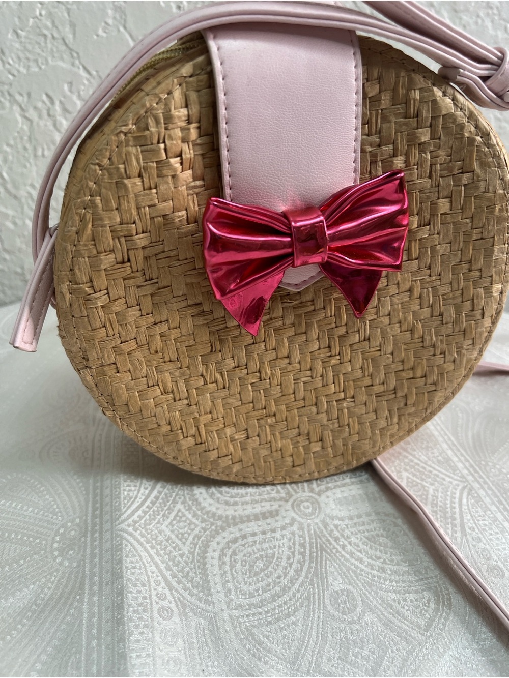 Juicy Couture Pink Trim Round Straw Crossbody with Metallic Pink Bow